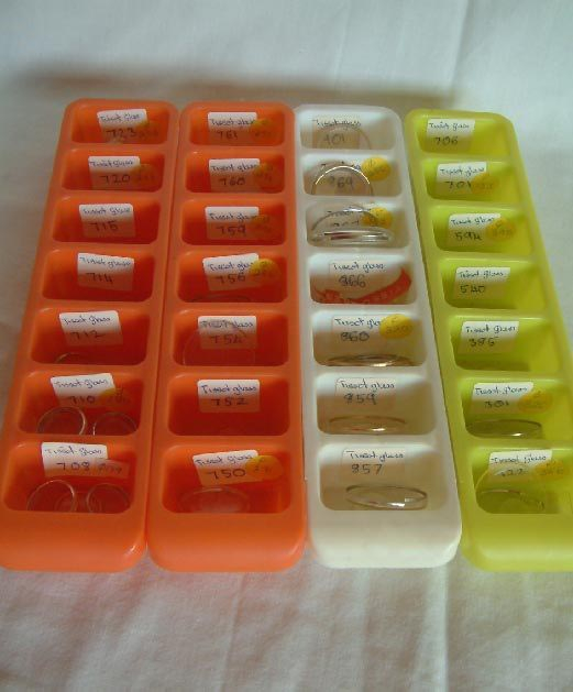 4 trays of Tissot watch crystals and inserts for men and women's watches